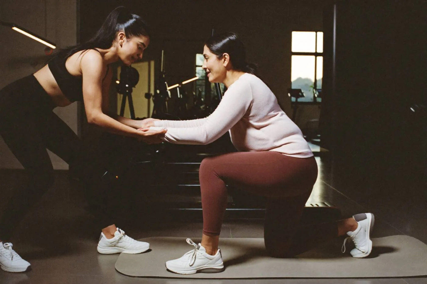 Trainer coaching a client
